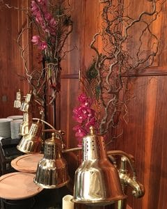 Buffet decorations with burgundy orchids on hazelnut branch
