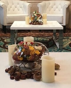Cocktail decoration with berries, chestnuts and candles