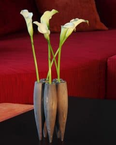 White calla lilies in wooden vase