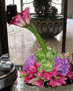 Purple and pink buffet decoration in bowl, with burgundy calla